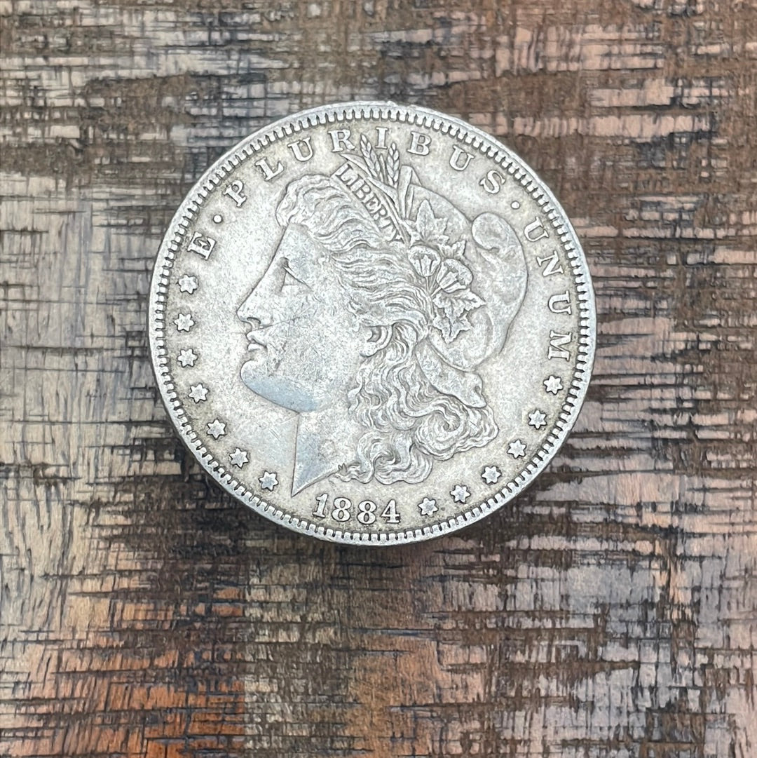 1884 $1 US Morgan Silver Dollar