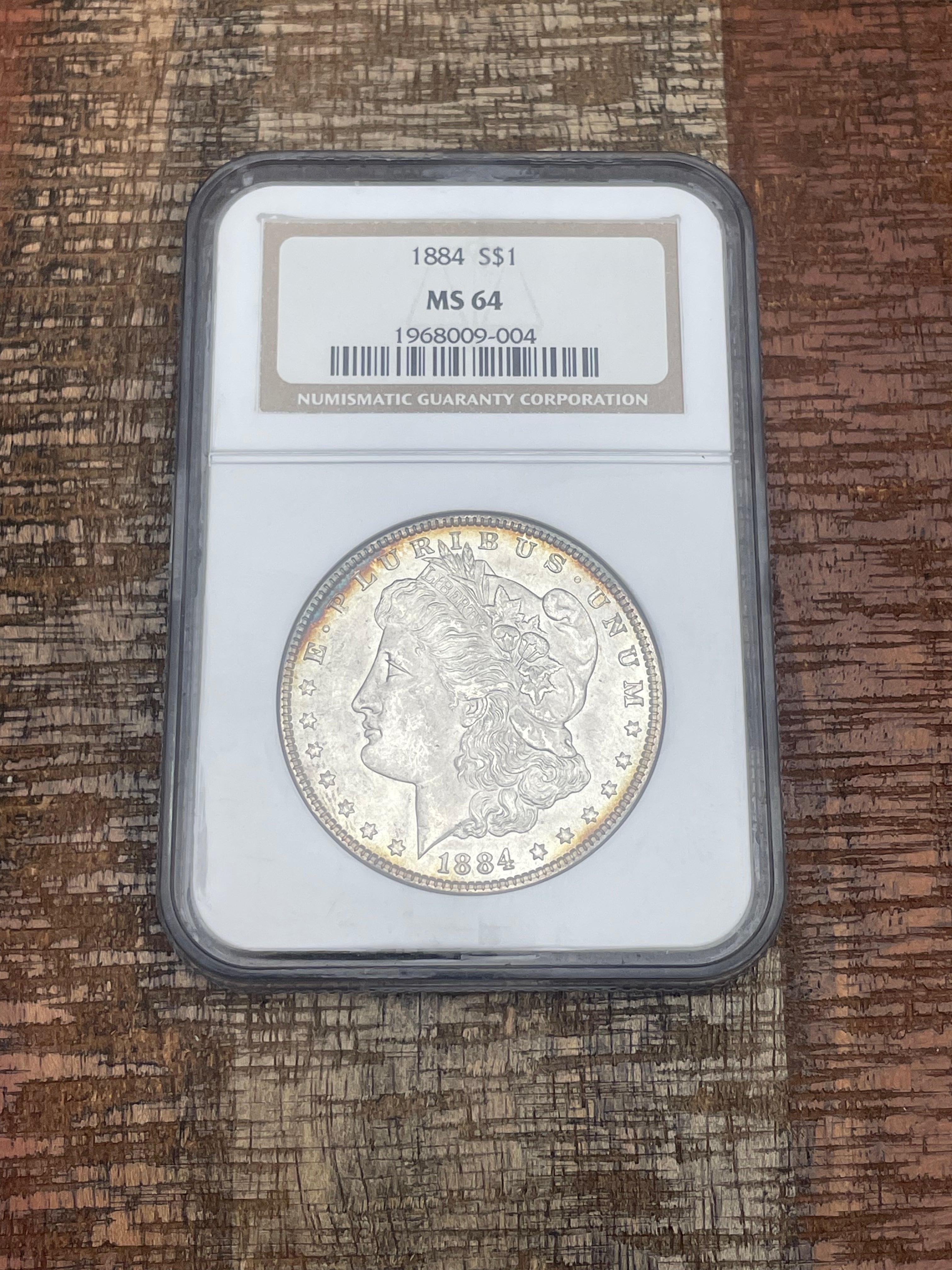 1884 $1 US Morgan Silver Dollar NGC MS64