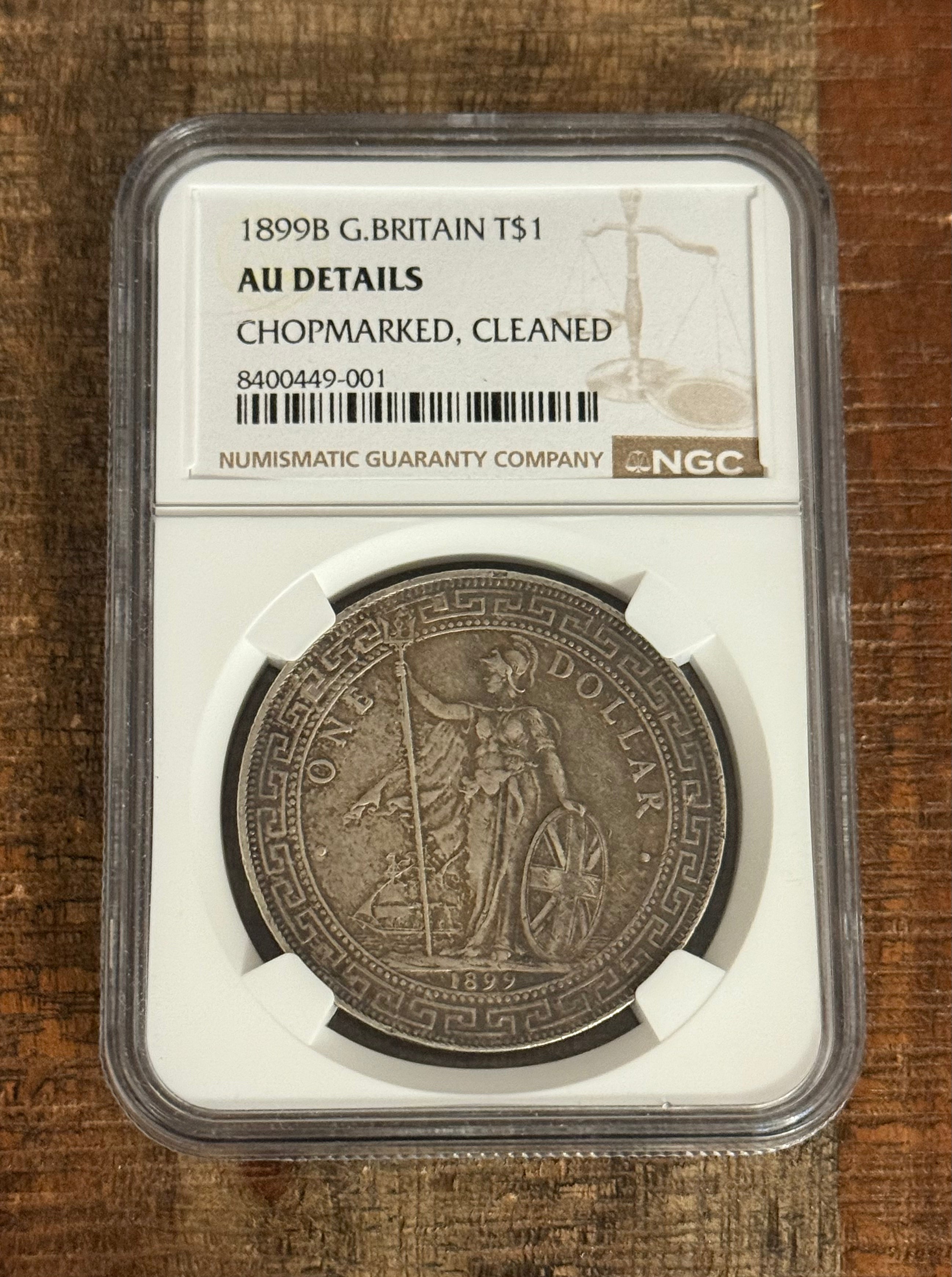 1899-B $1 G. Britain Trade Dollar ~ NGC  AU Details-Chopmarked, Cleaned