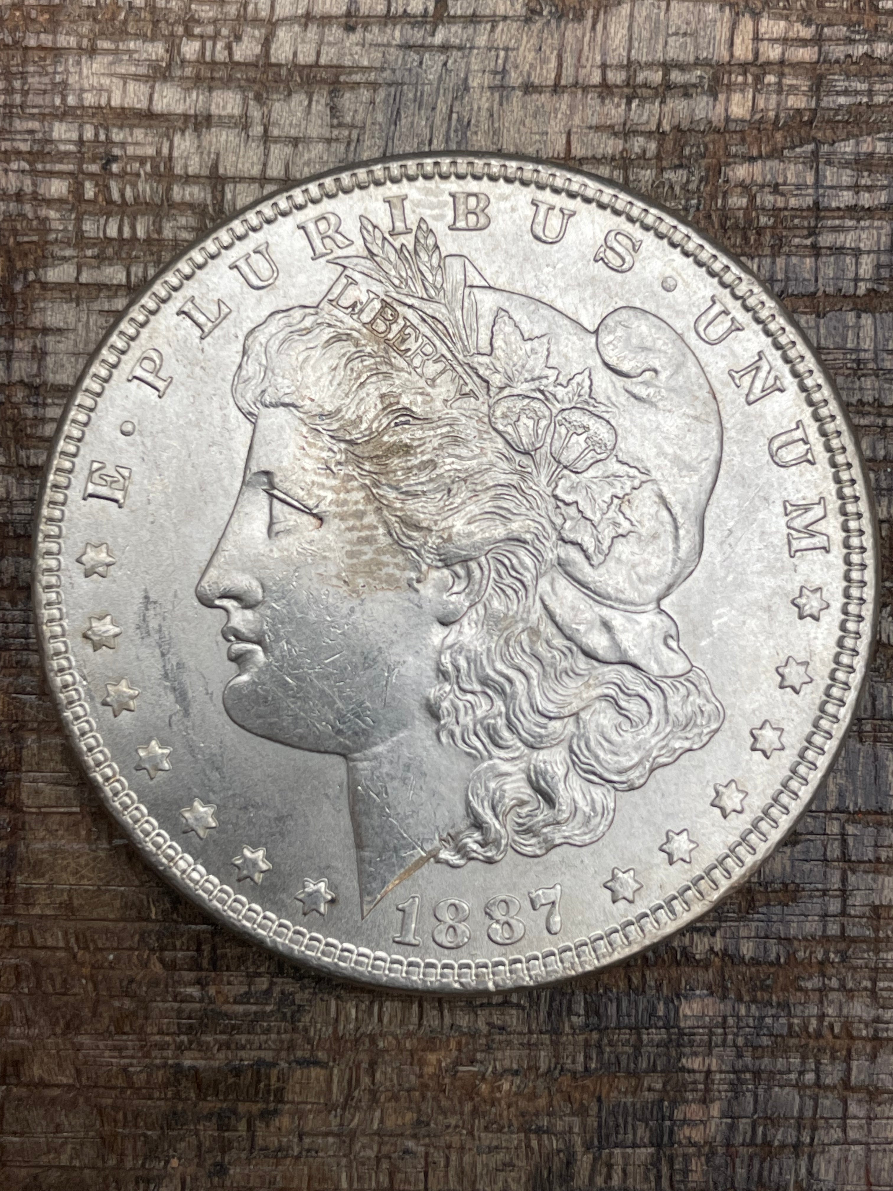 1887 $1 US Morgan Silver Dollar