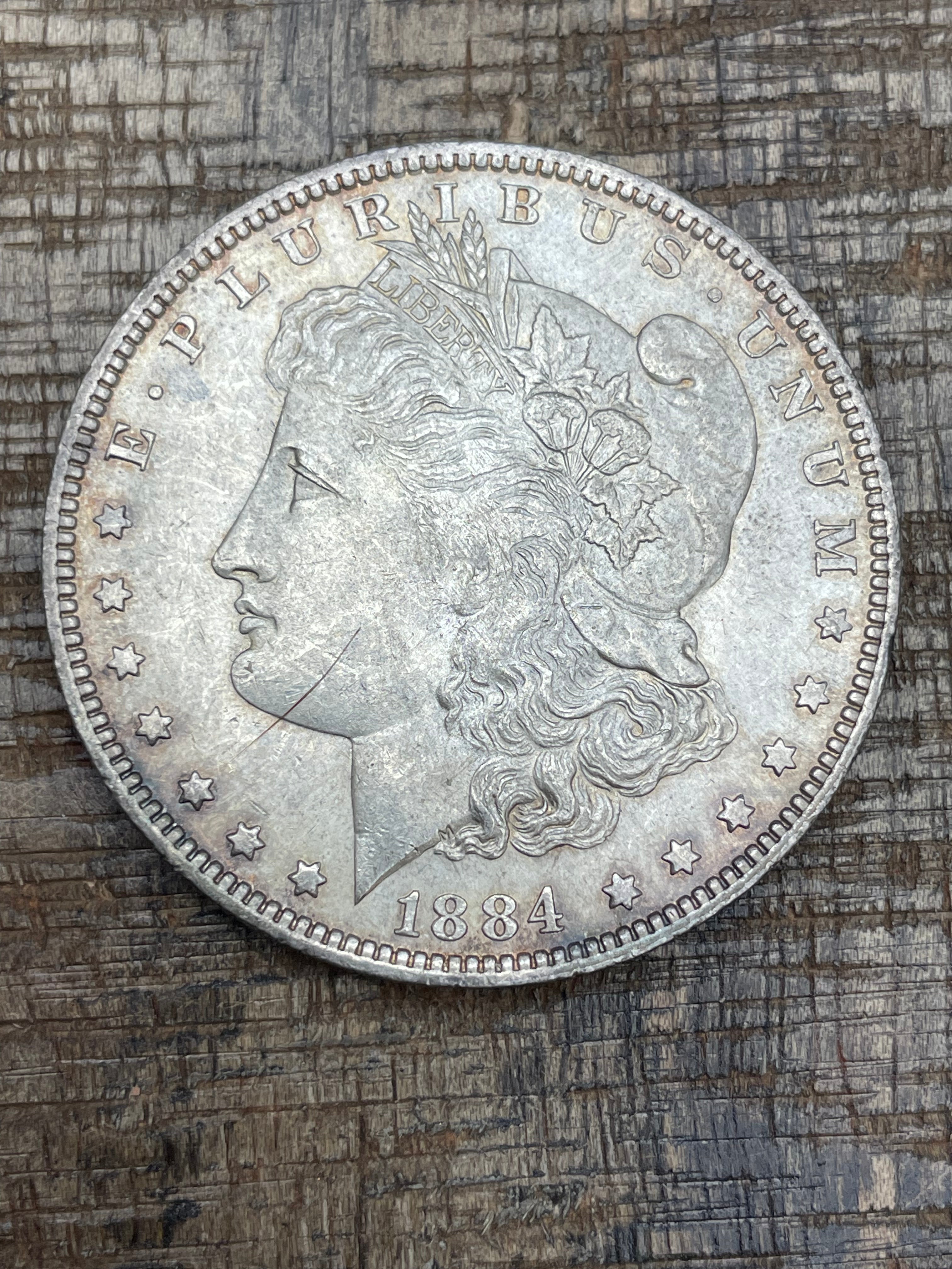 1884-O $1 US Morgan Silver Dollar