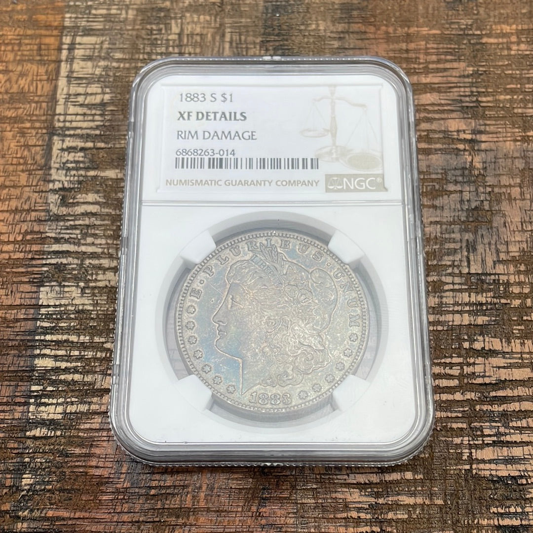1883-S $1 US Morgan Silver Dollar. NGC graded XF Details/Rim Damage