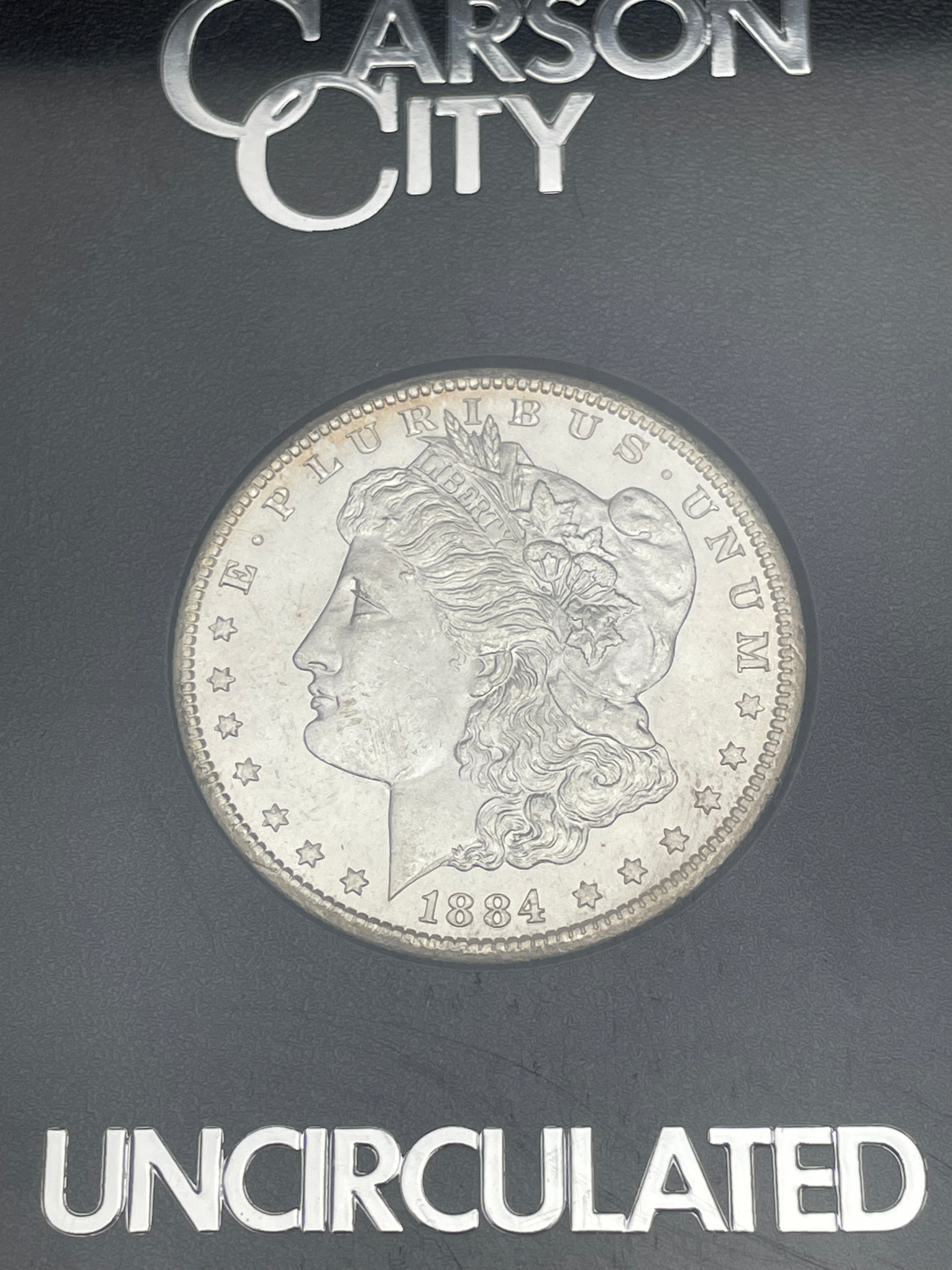 1884-CC $1 US Morgan Silver Dollar GSA Carson City