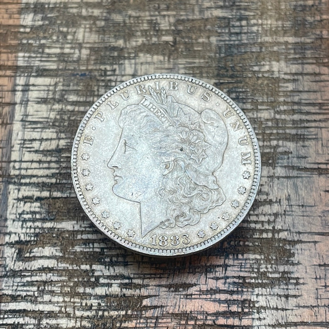 1883-O $1 US Morgan Silver Dollar