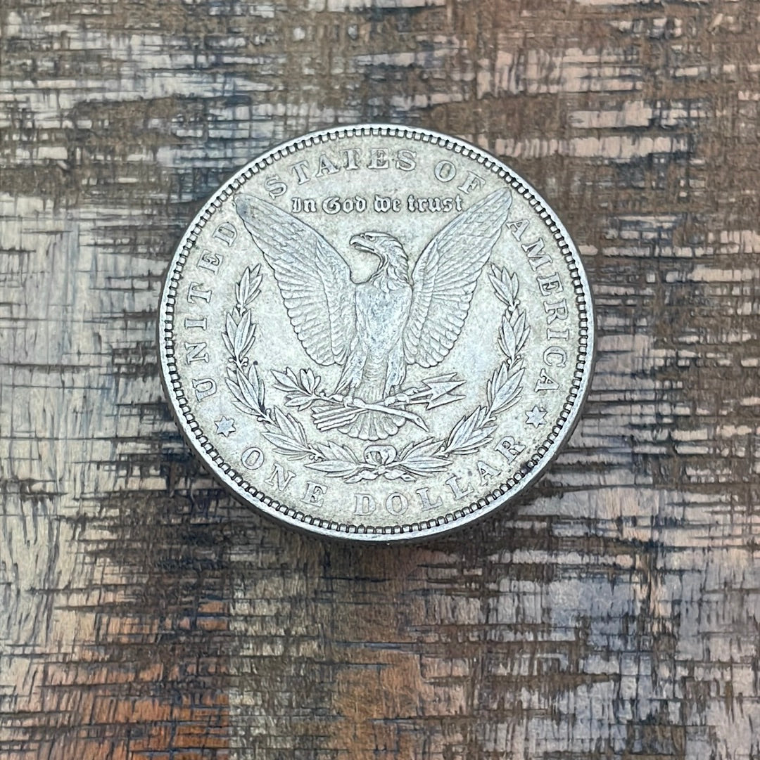 1885 $1 US Morgan Silver Dollar.