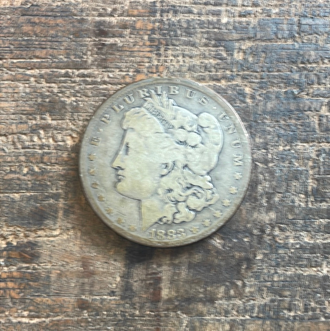 1883-O $1 US Morgan Silver Dollar