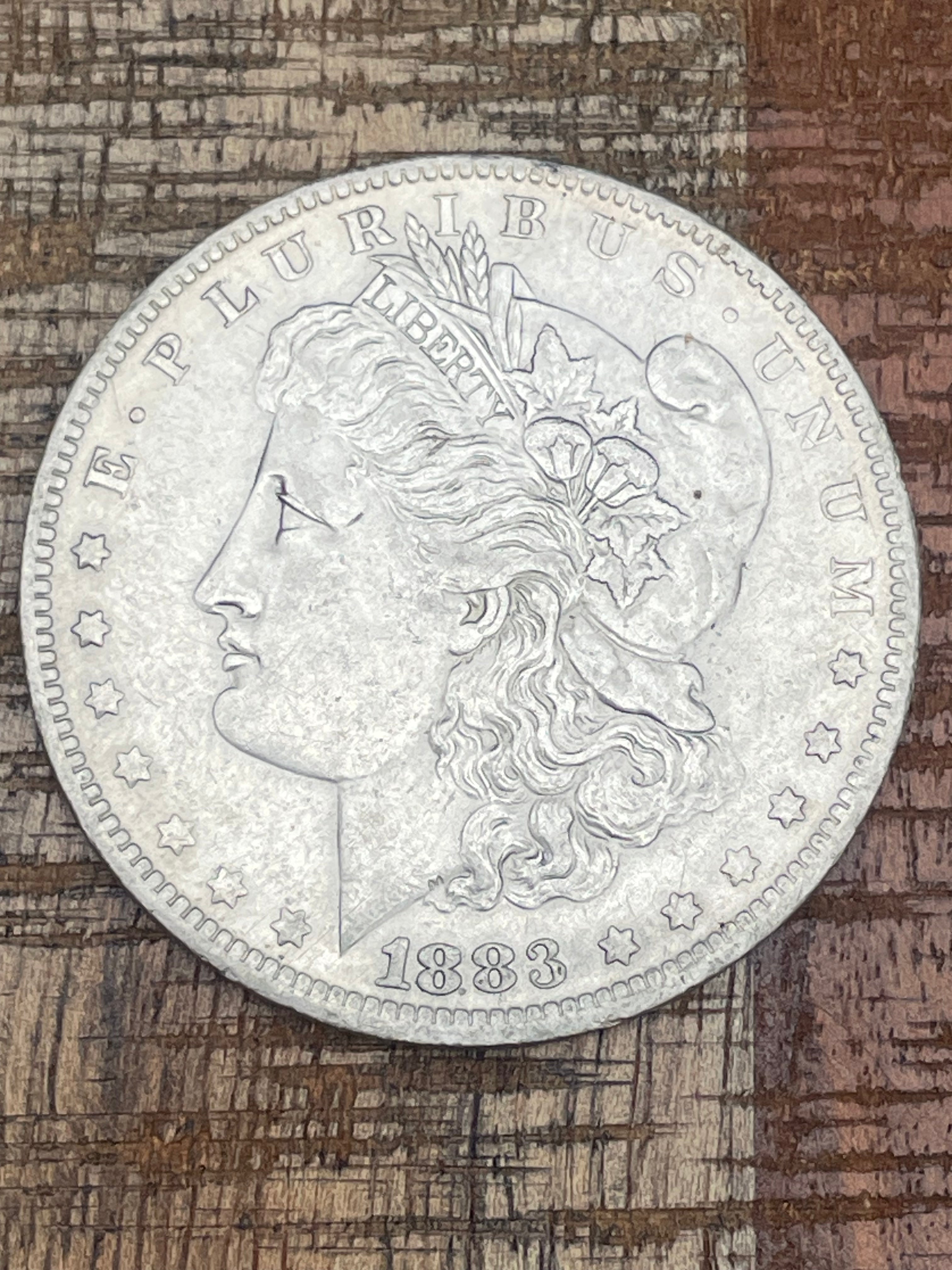 1883-O $1 US Morgan Silver Dollar