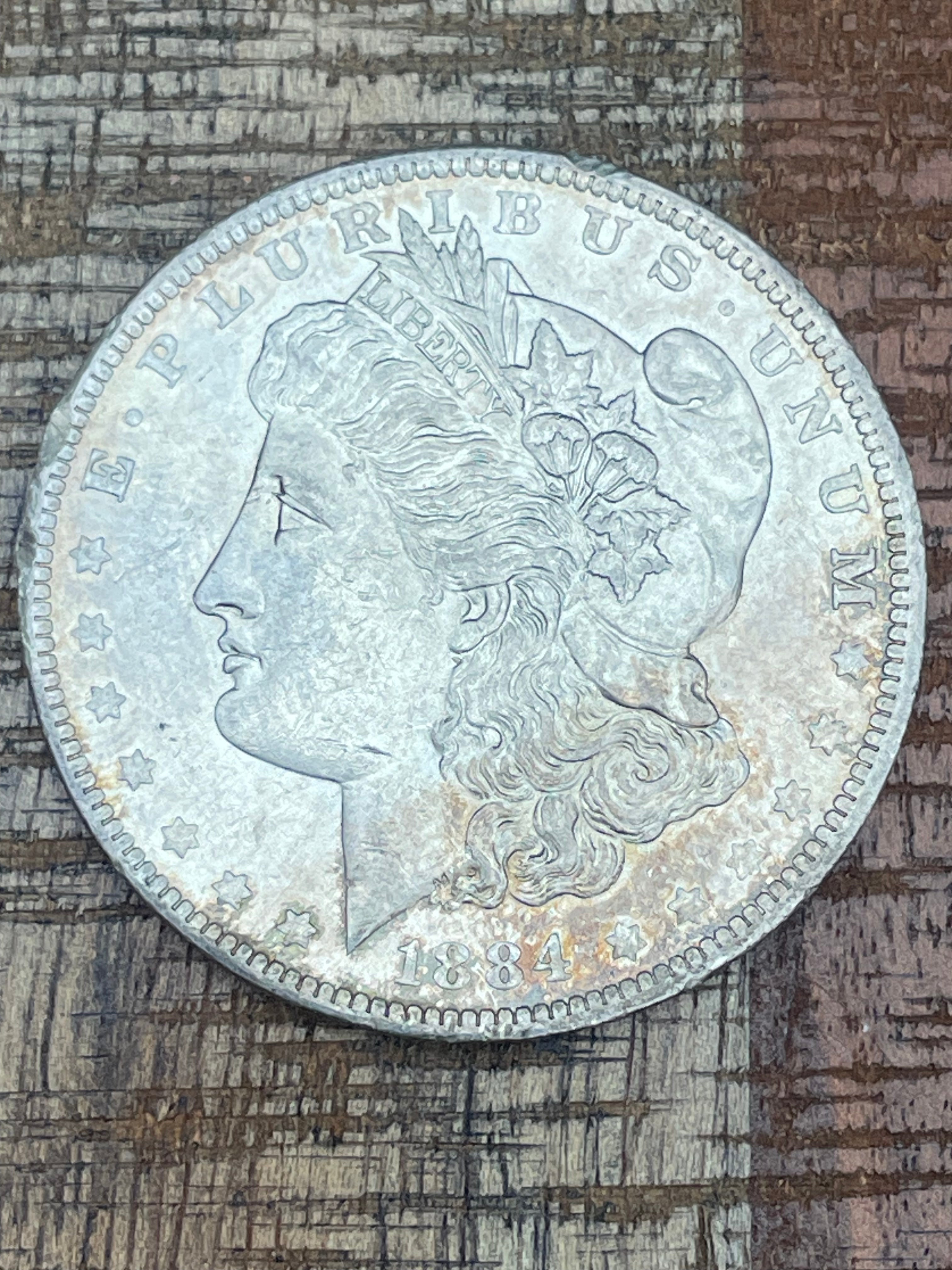 1884-O $1 US Morgan Silver Dollar