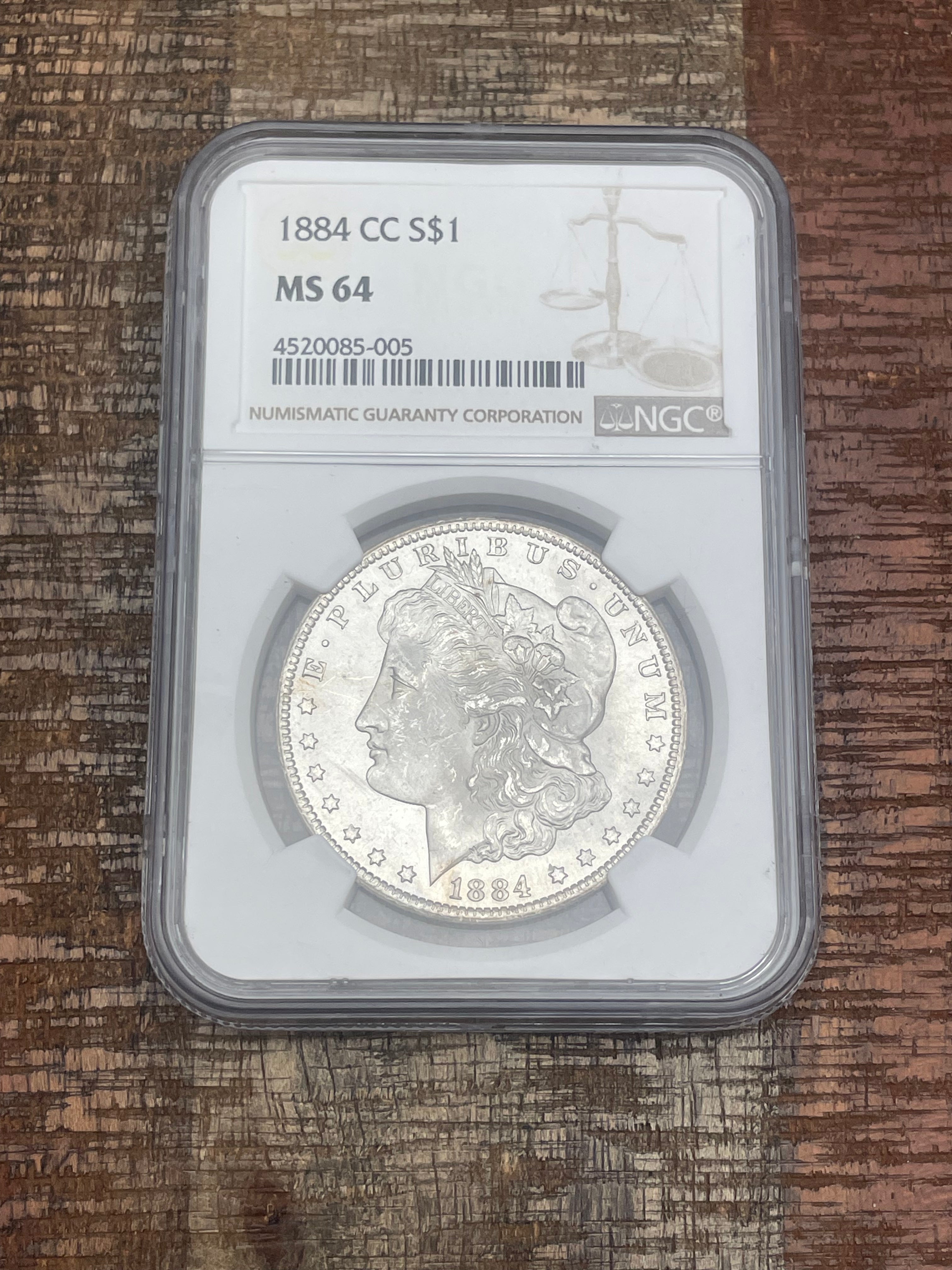 1884-CC $1 US Morgan Silver Dollar ~ NGC MS64