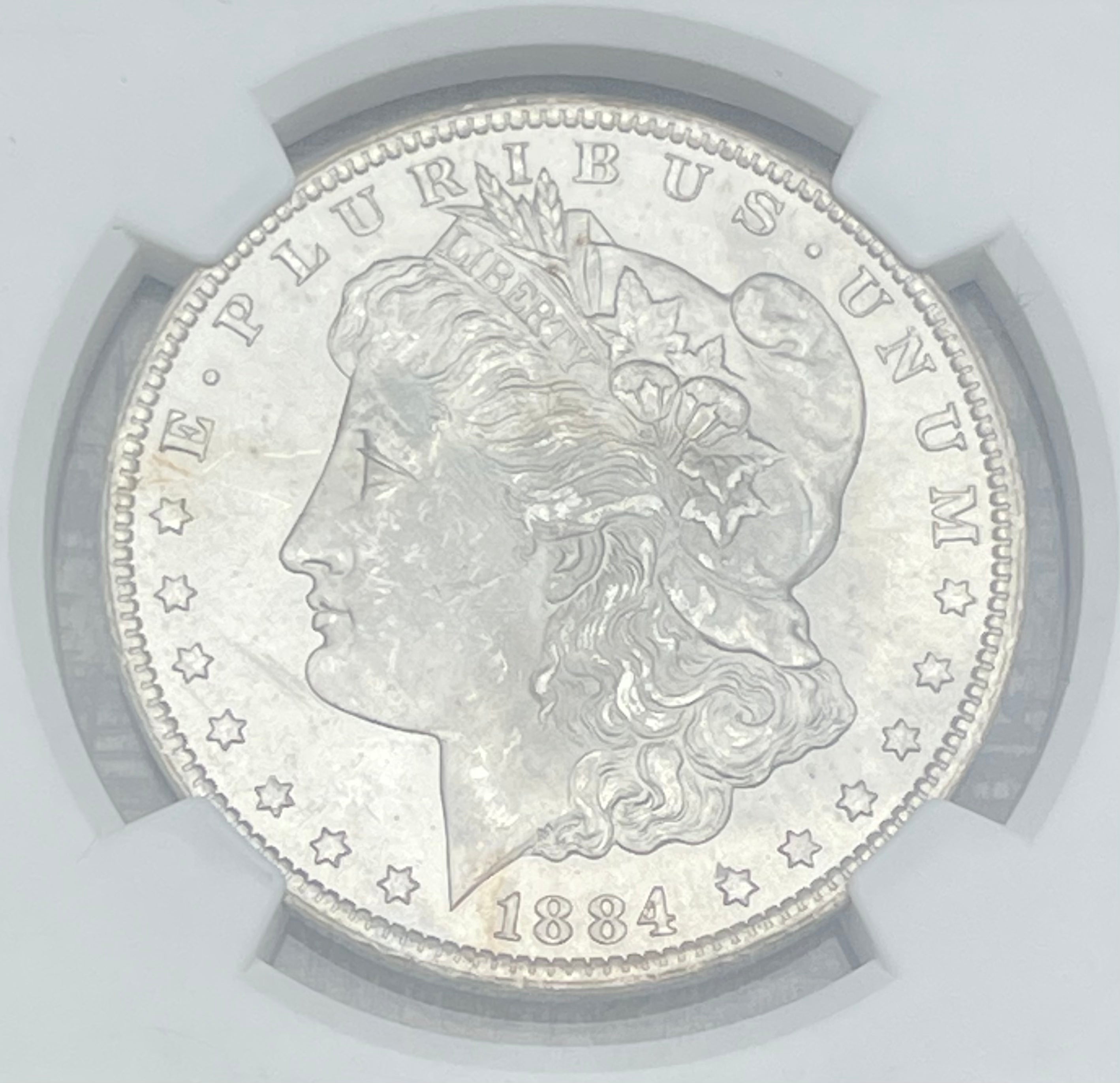 1884-CC $1 US Morgan Silver Dollar ~ NGC MS64