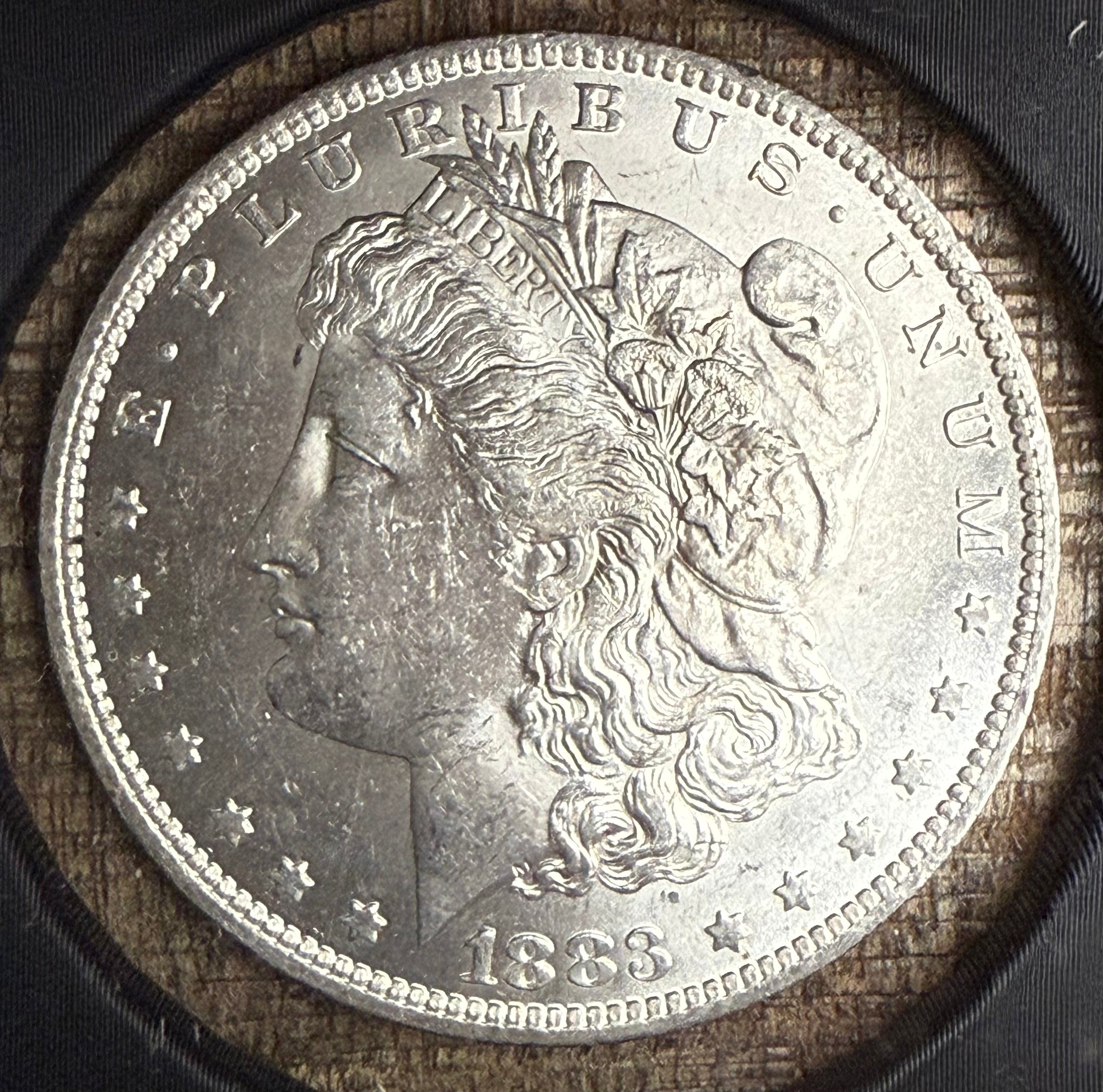 1883-O $1 US Morgan Silver Dollar
