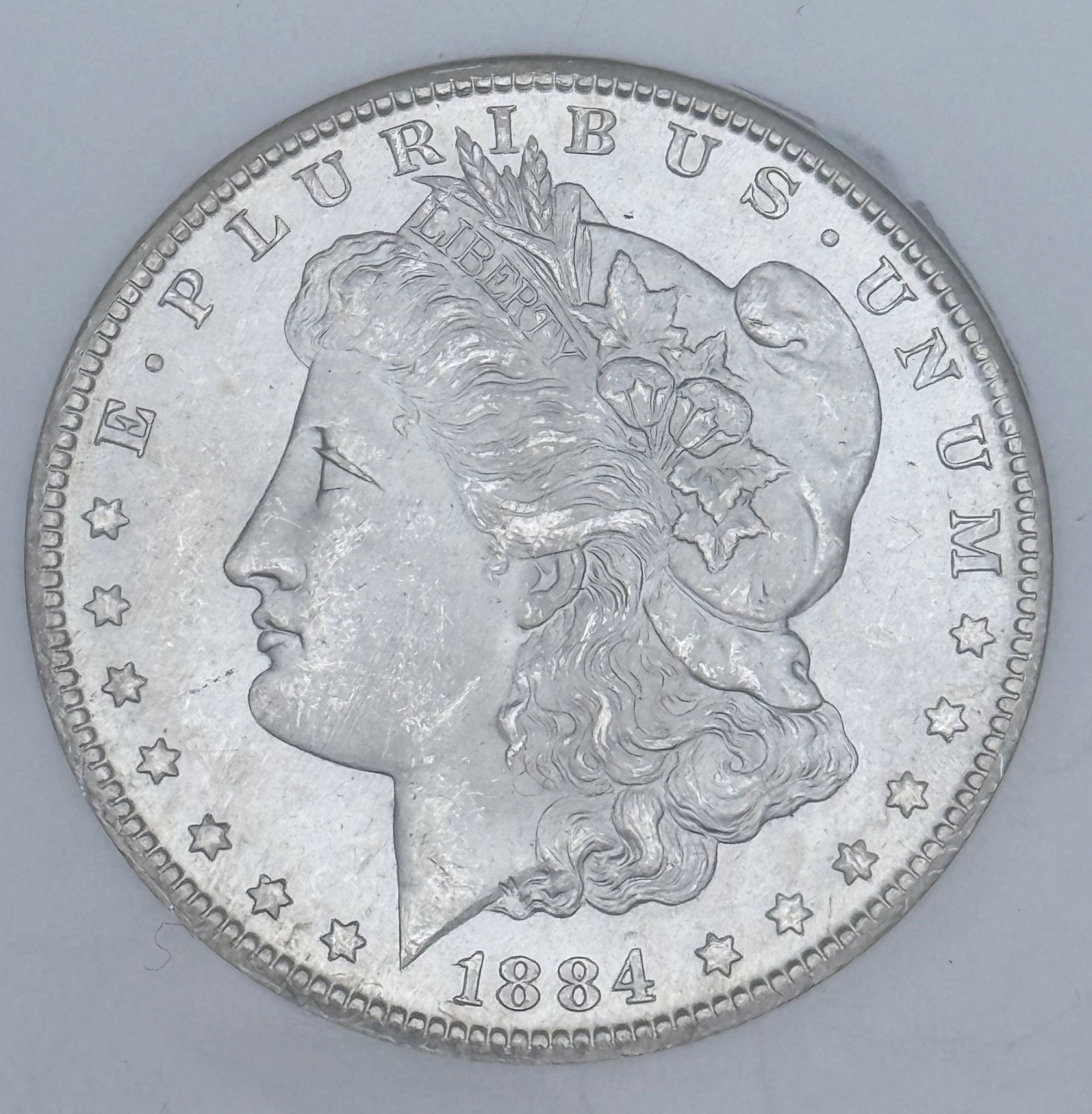 1884-CC $1 US Morgan Silver Dollar ~ NGC MS64