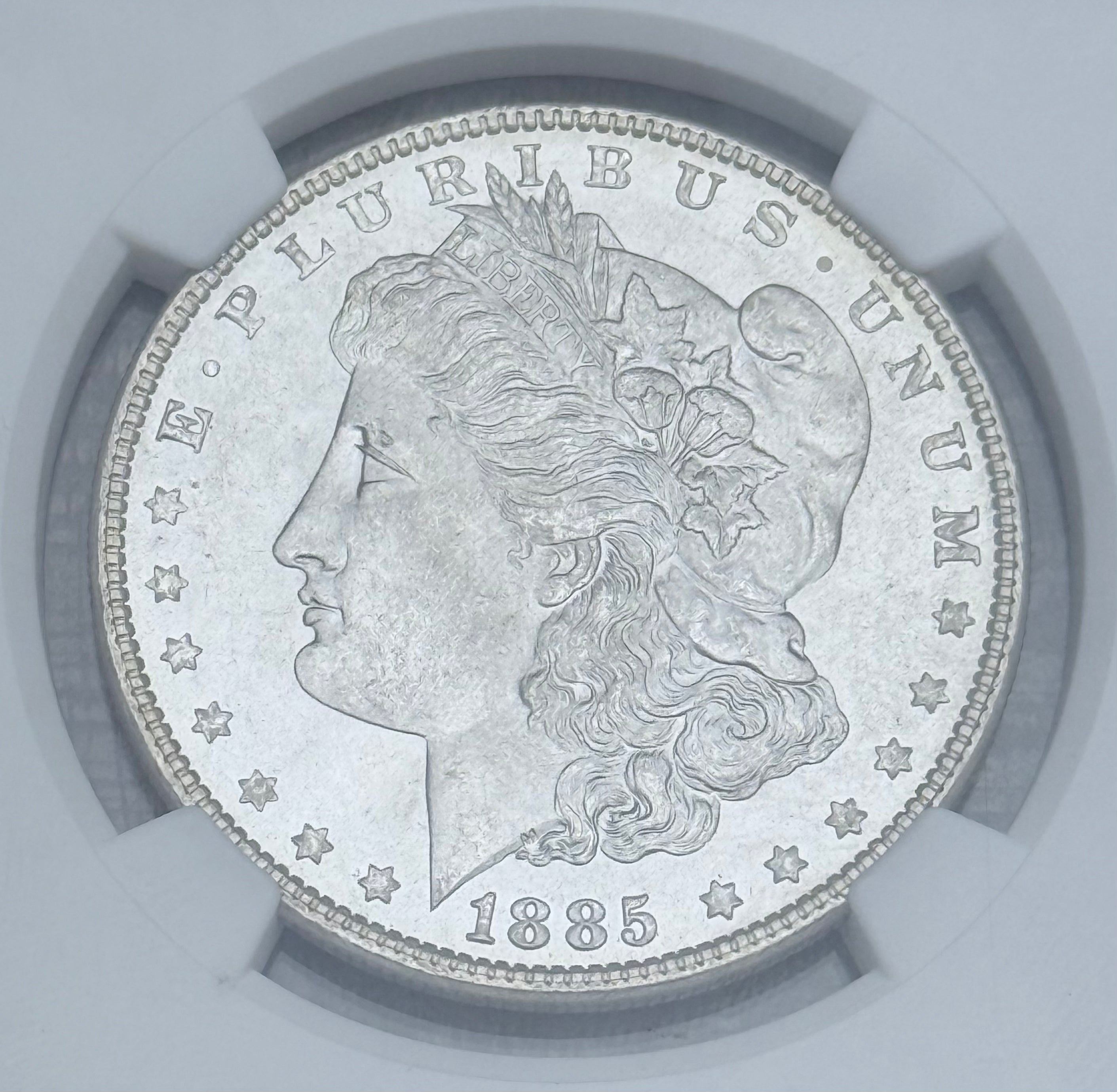 1885 $1 US Morgan Silver Dollar ~ NGC MS64