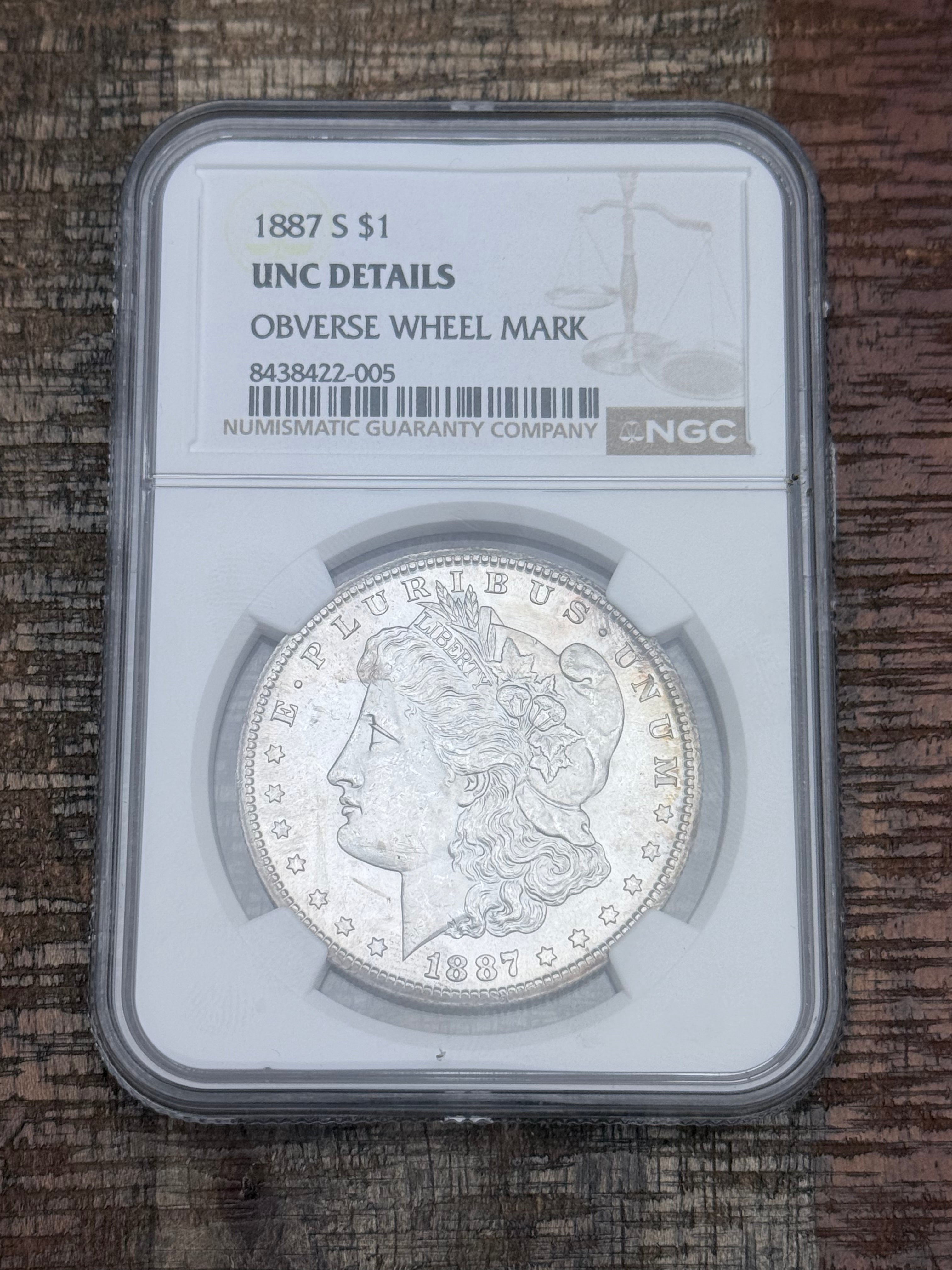 1887 $1 US Morgan Silver Dollar NGC Uncirculated Details ~ Obverse Wheel Mark