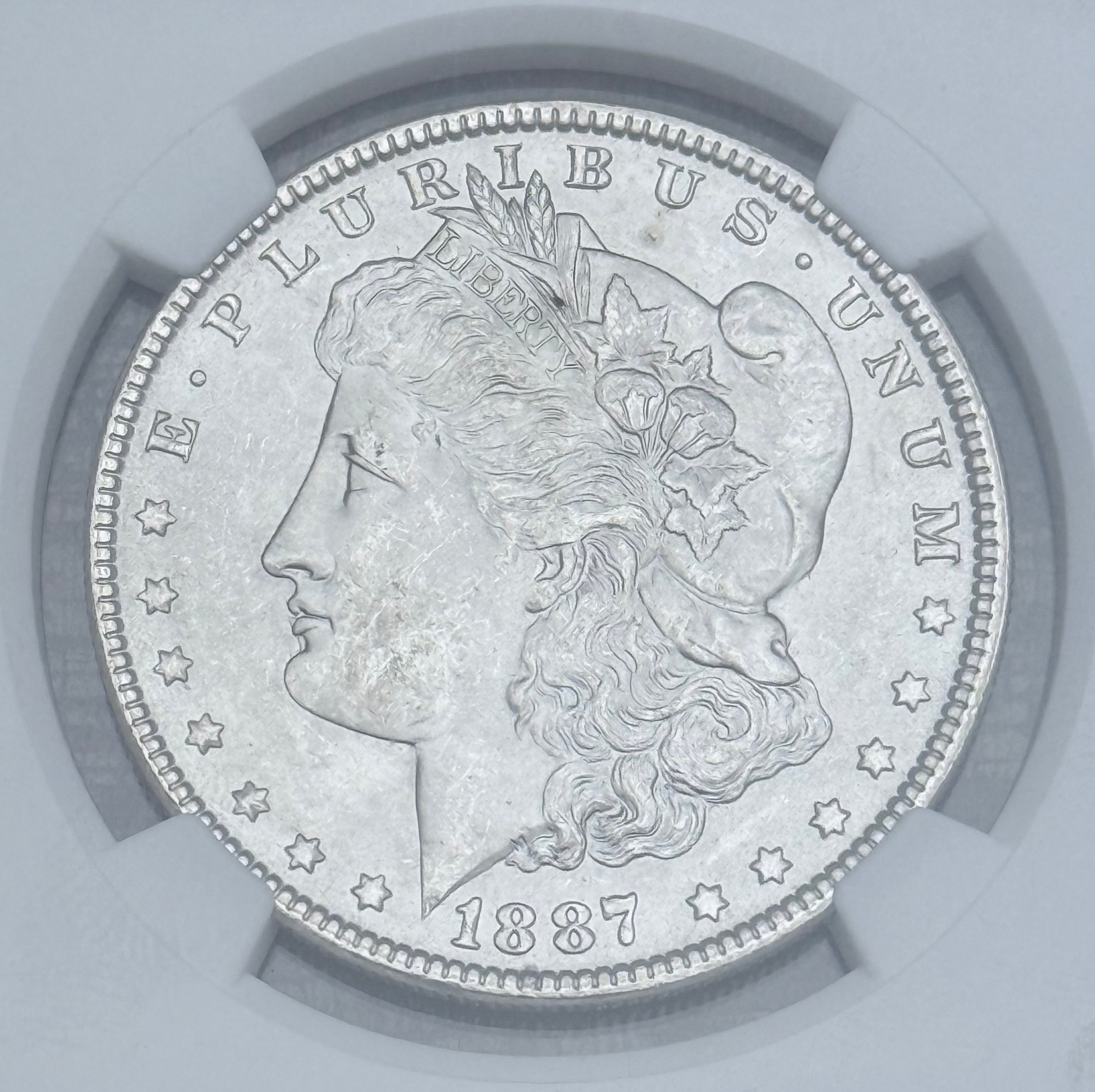 1887 $1 US Morgan Silver Dollar ~ NGC MS63