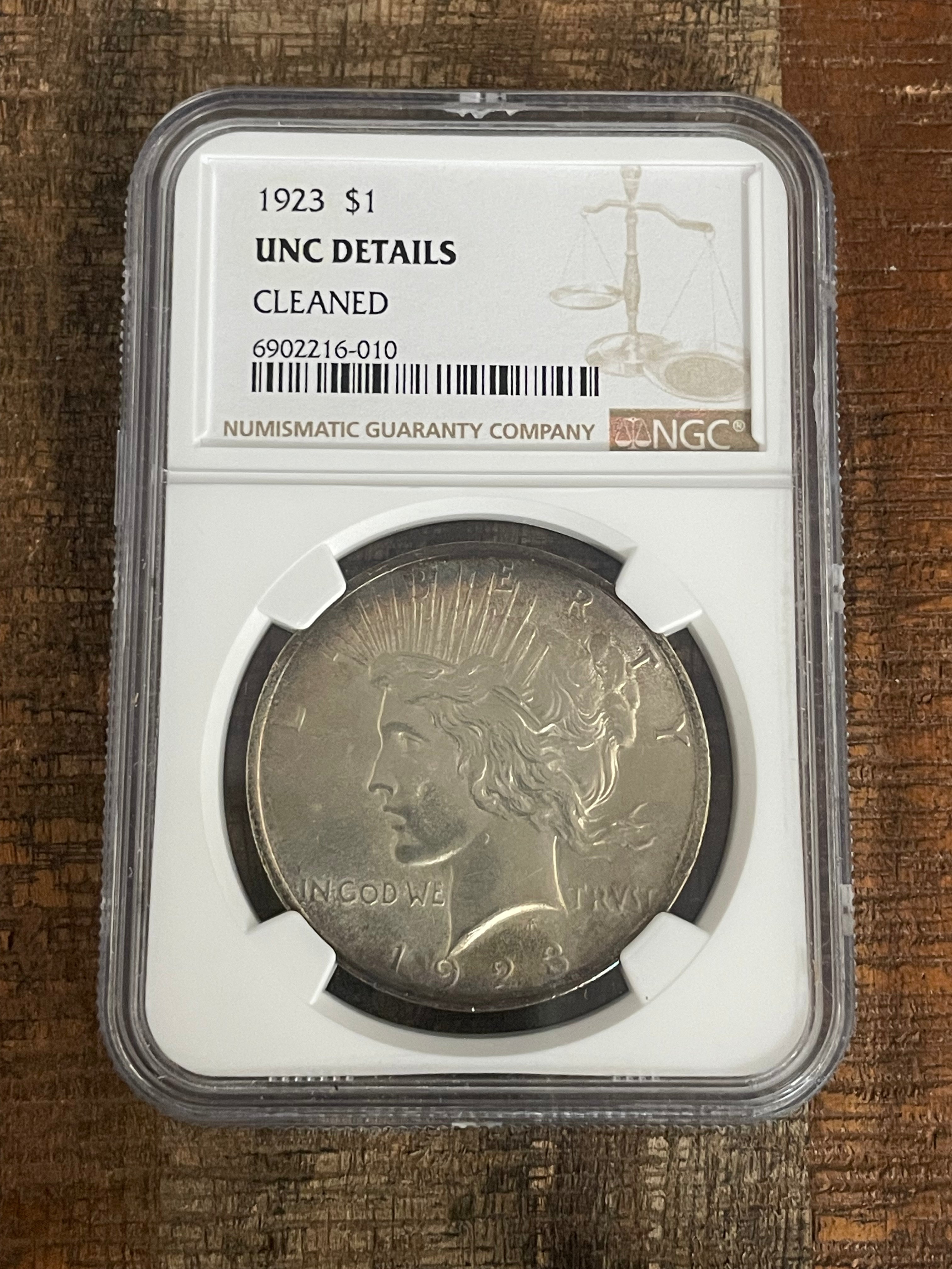 1923 $1 US Silver Peace Dollar NGC UNC Details ~ Cleaned ~ Toning