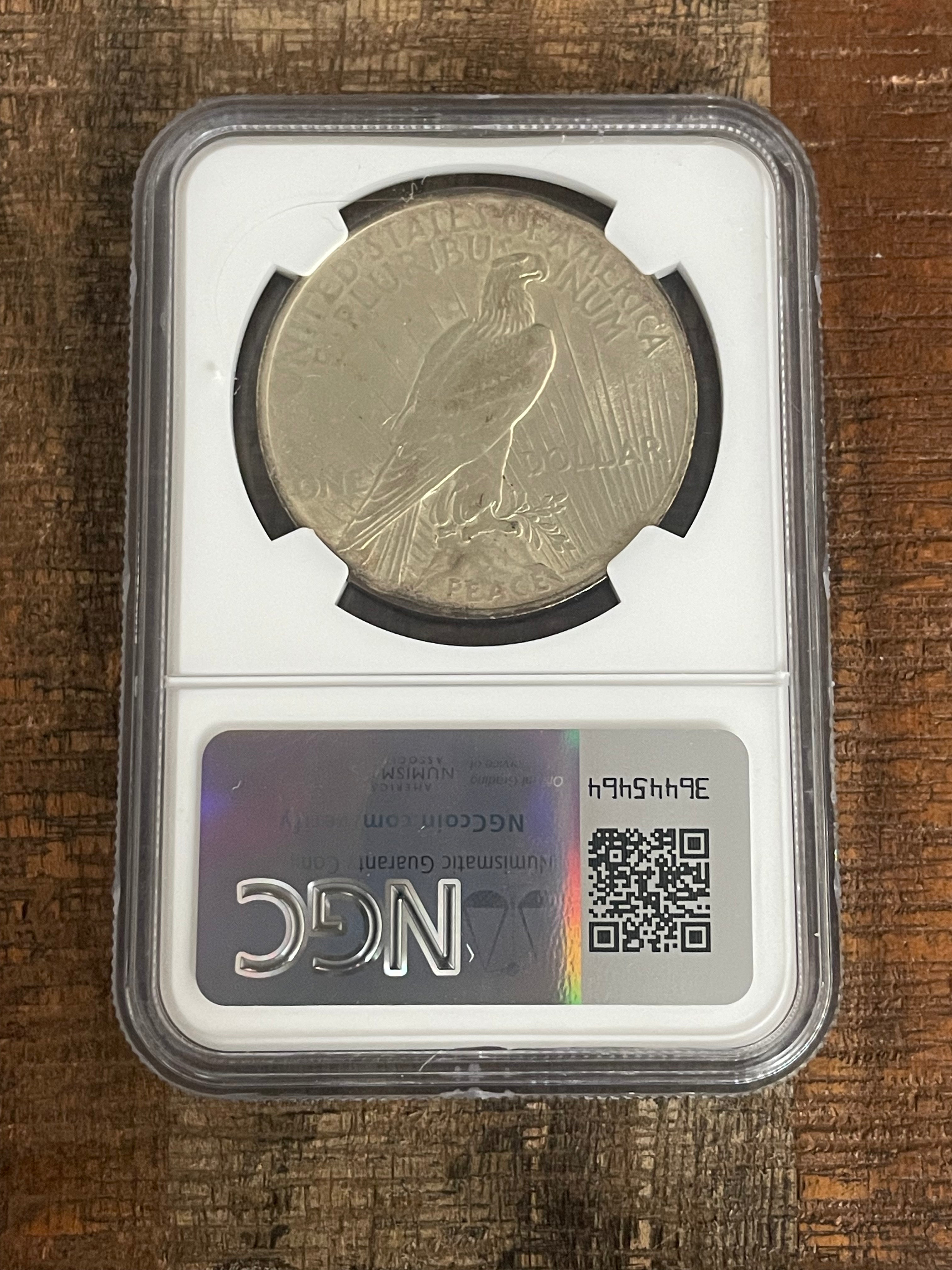 1923 $1 US Silver Peace Dollar NGC UNC Details ~ Cleaned ~ Toning