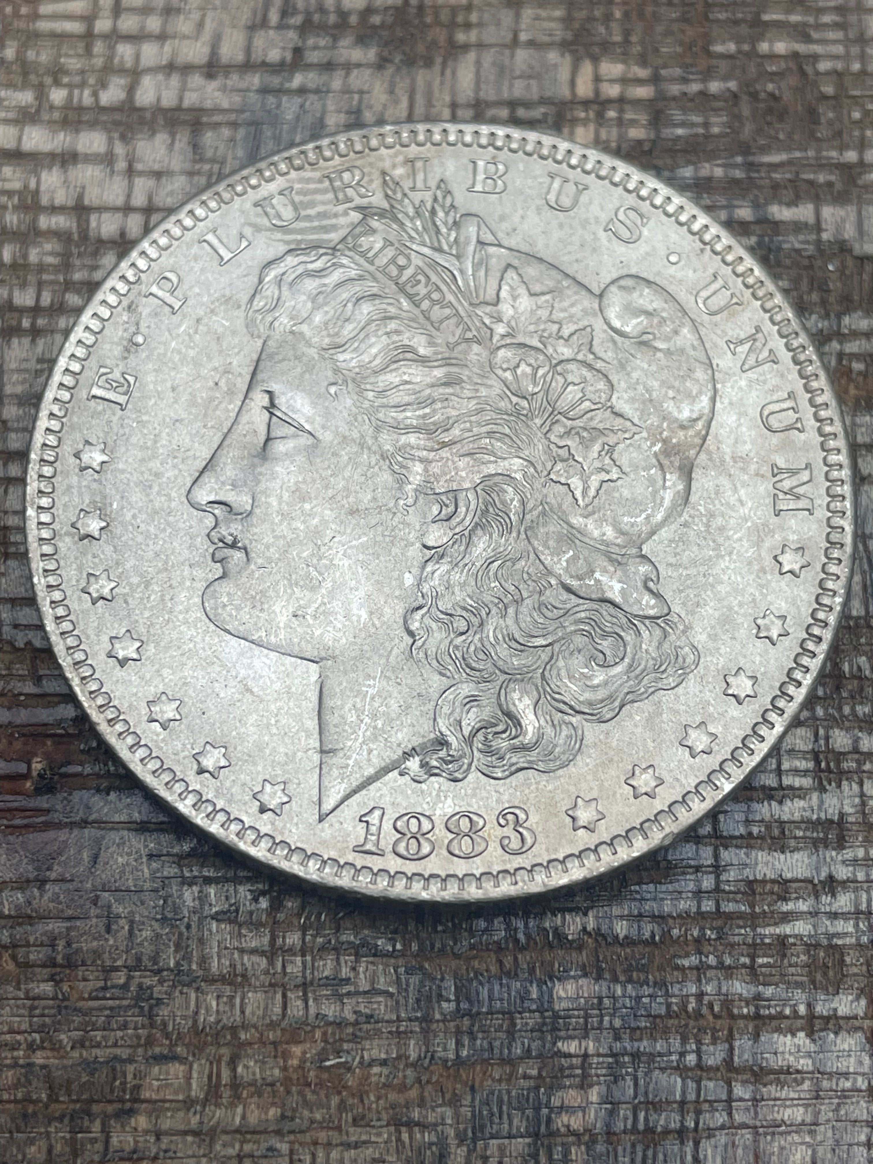 1883-O $1 US Morgan Silver Dollar