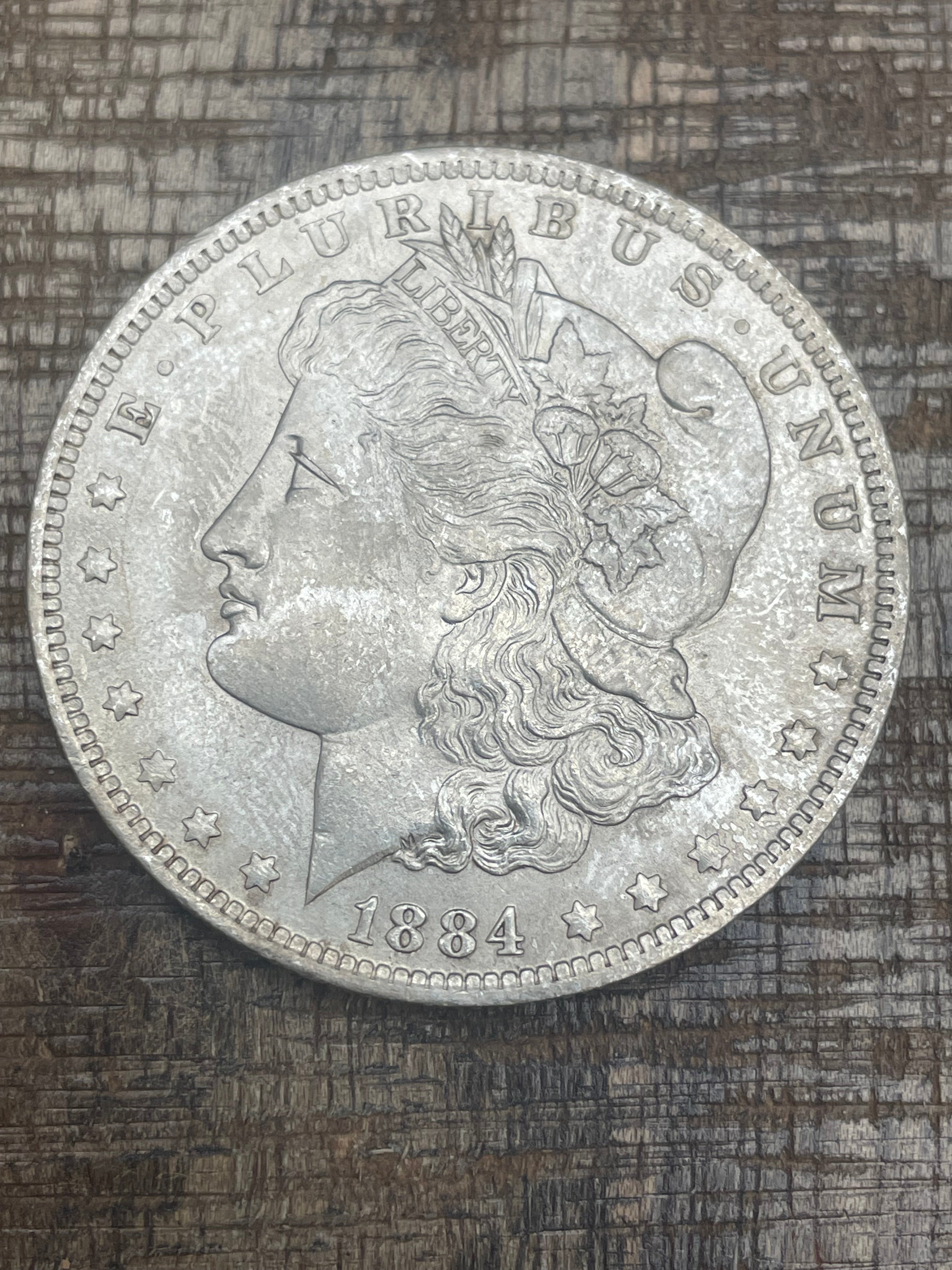 1884-O $1 US Morgan Silver Dollar