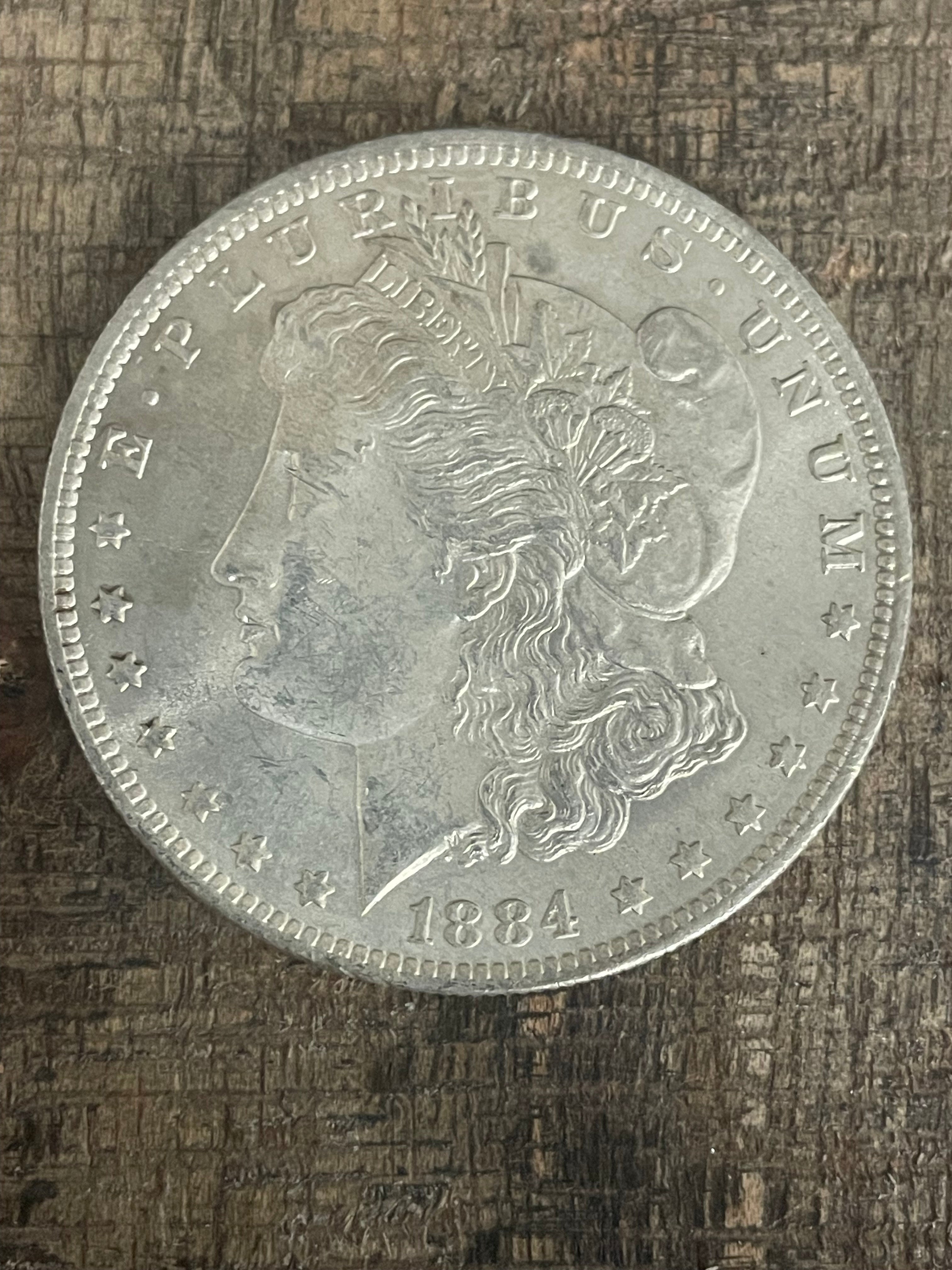 1884-O $1 US Morgan Silver Dollar
