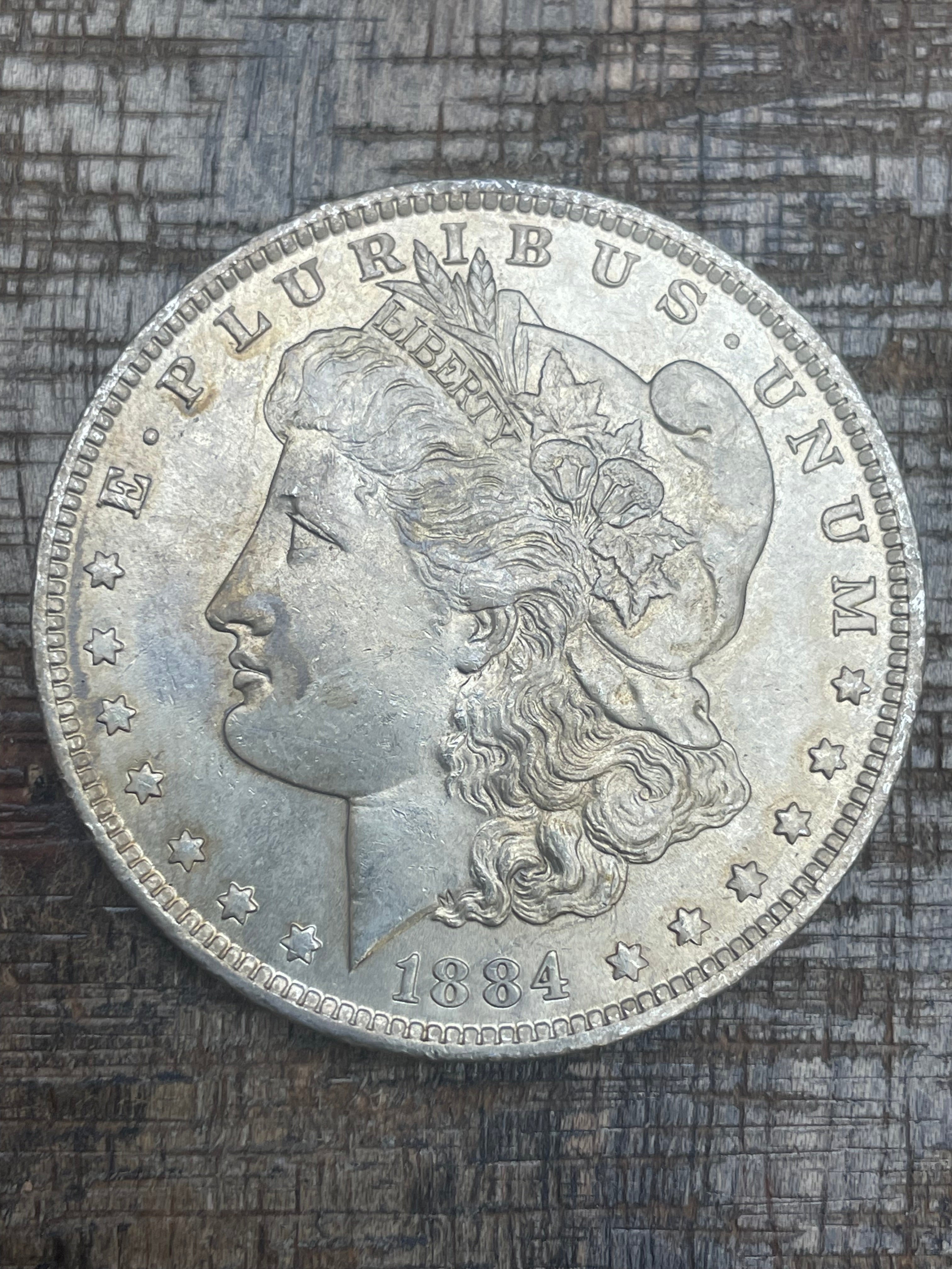1884-O $1 US Morgan Silver Dollar
