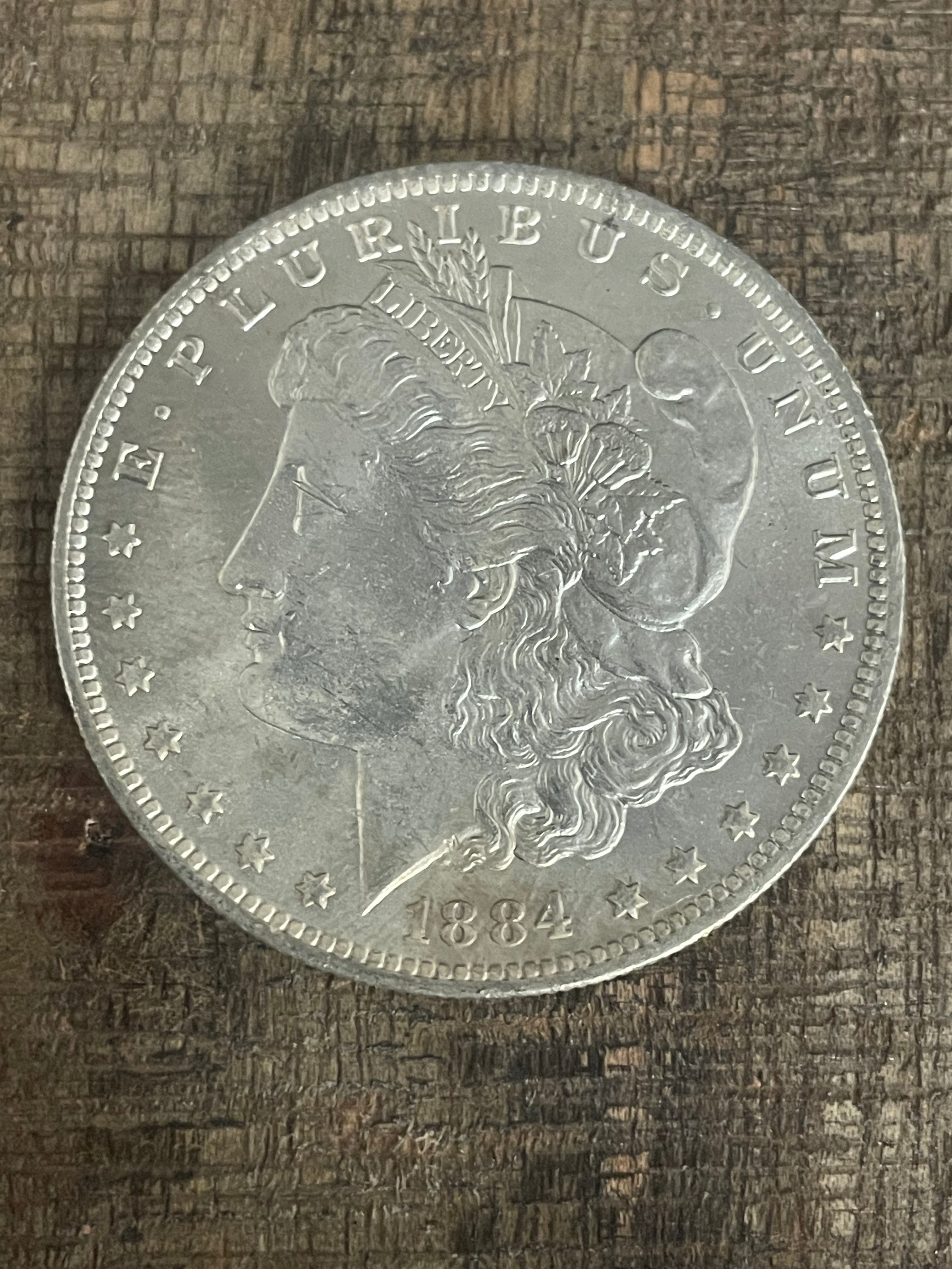 1884-O $1 US Morgan Silver Dollar