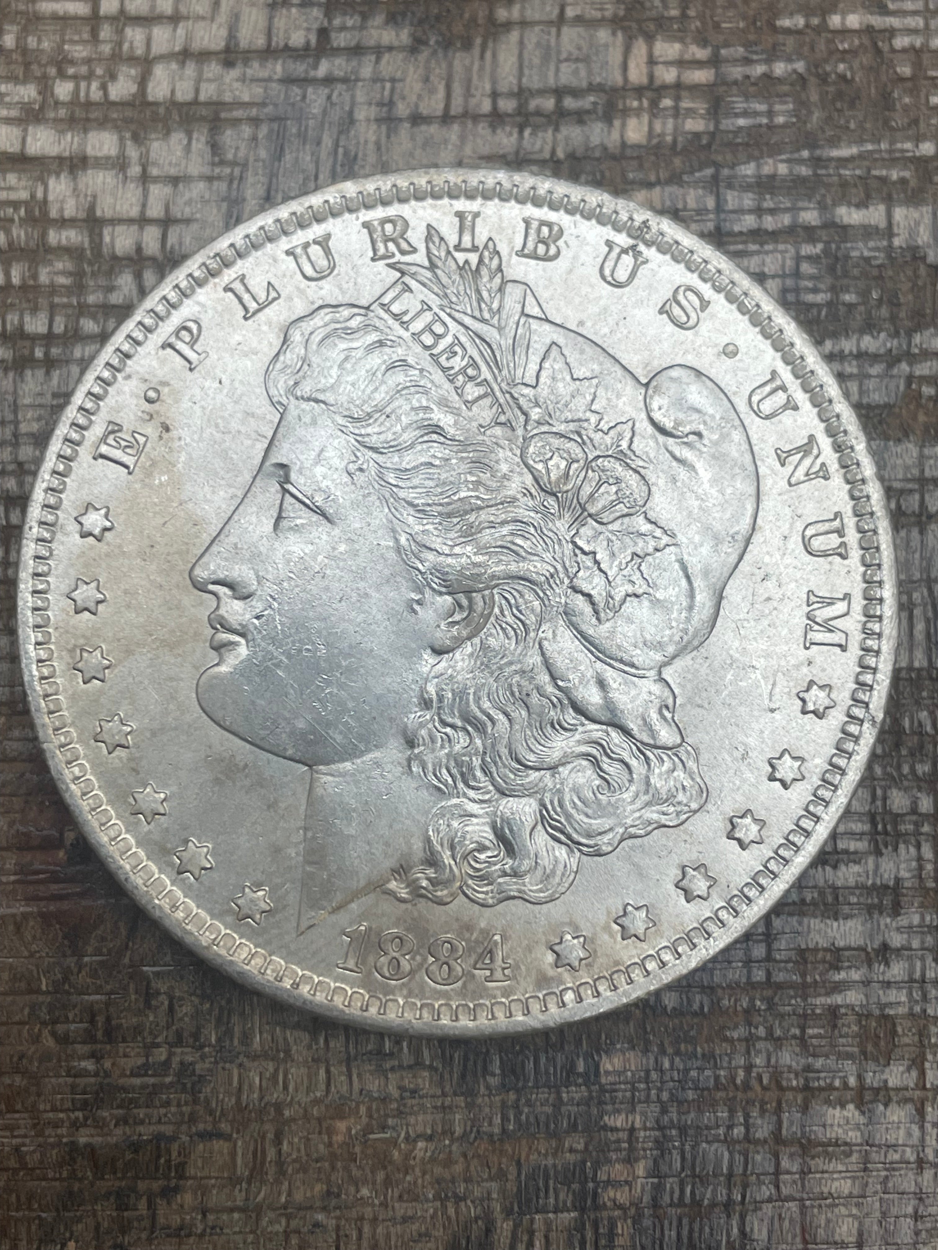 1884-O $1 US Morgan Silver Dollar