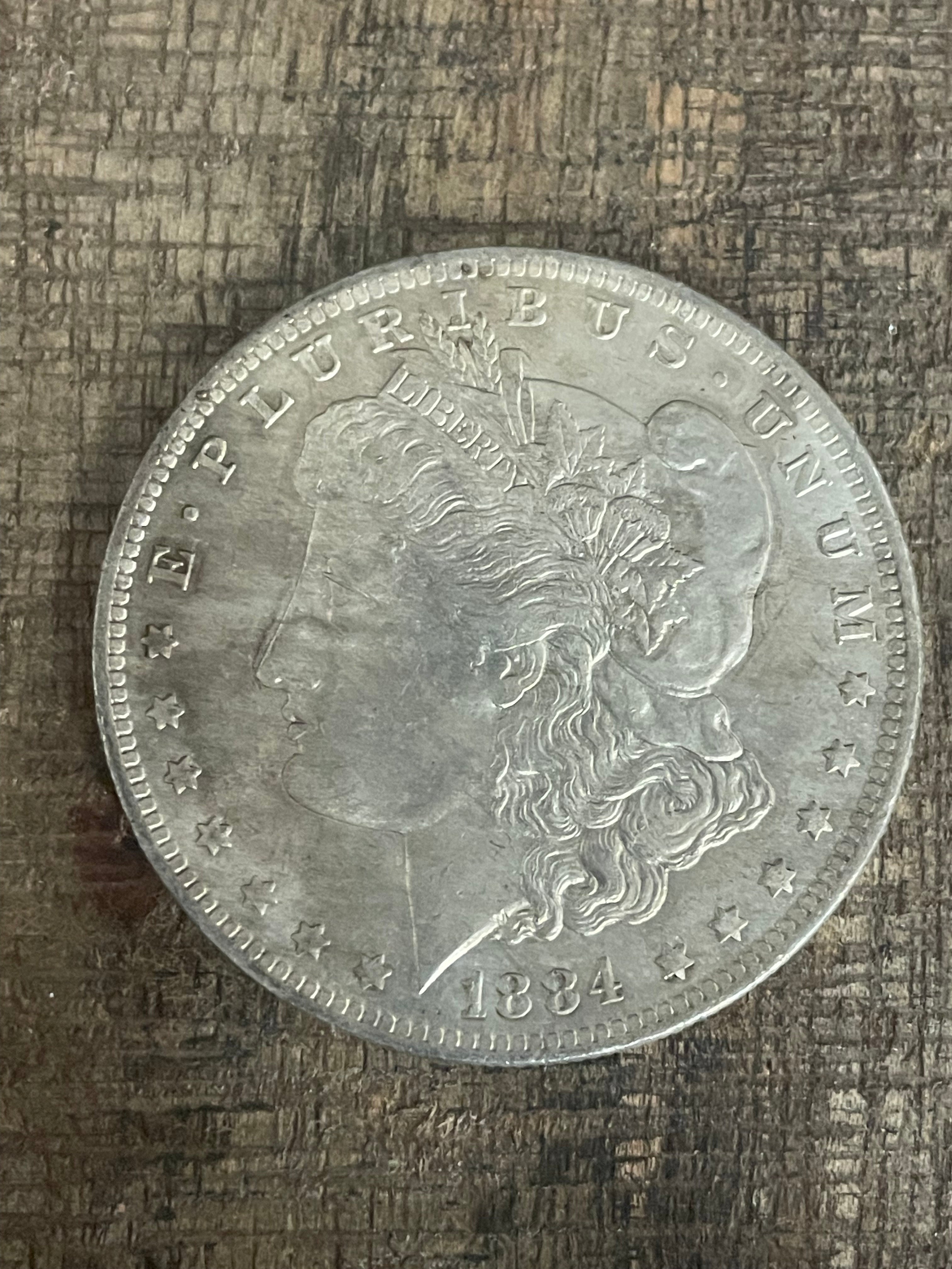 1884-O $1 US Morgan Silver Dollar