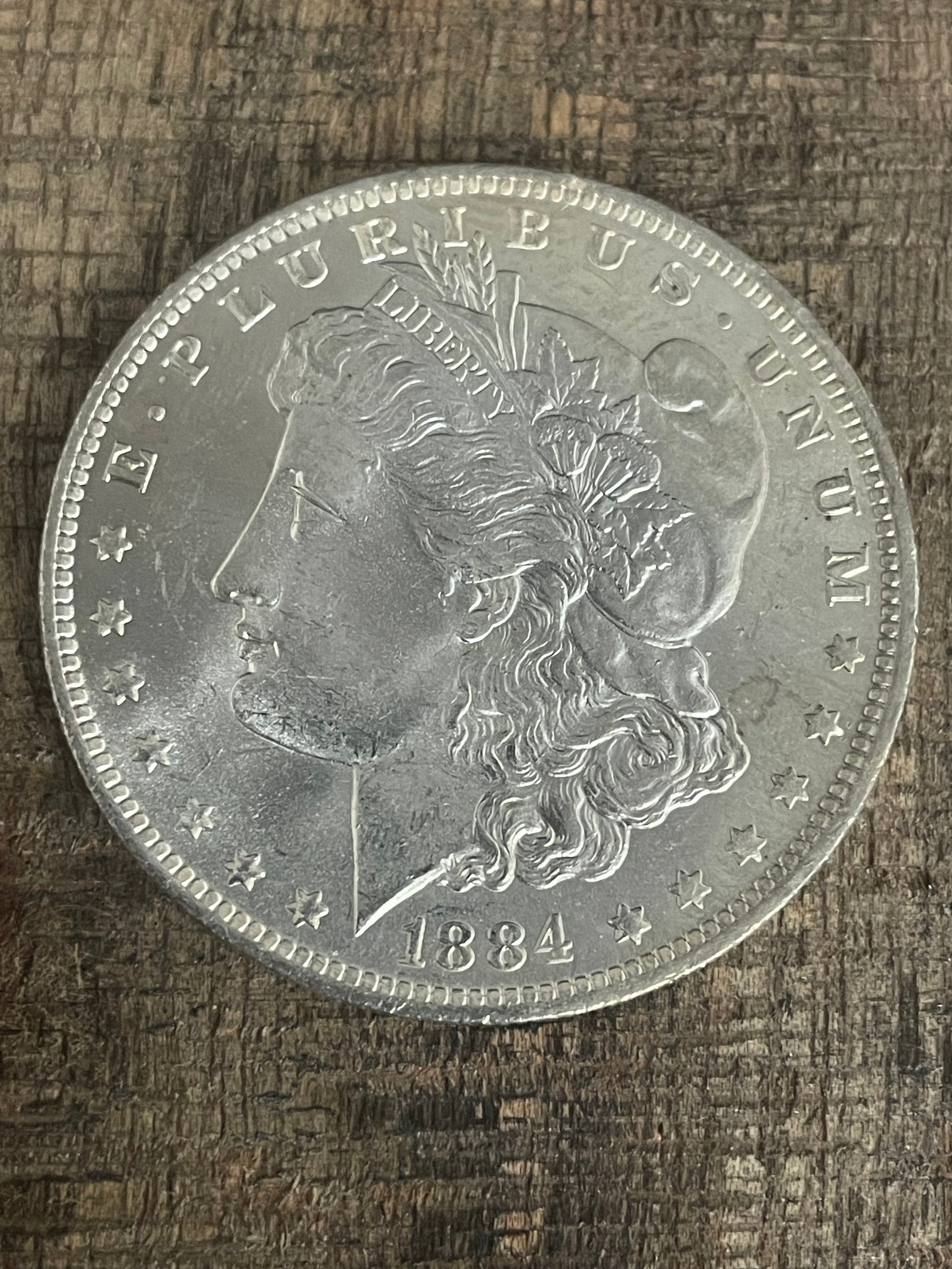 1884-O $1 US Morgan Silver Dollar