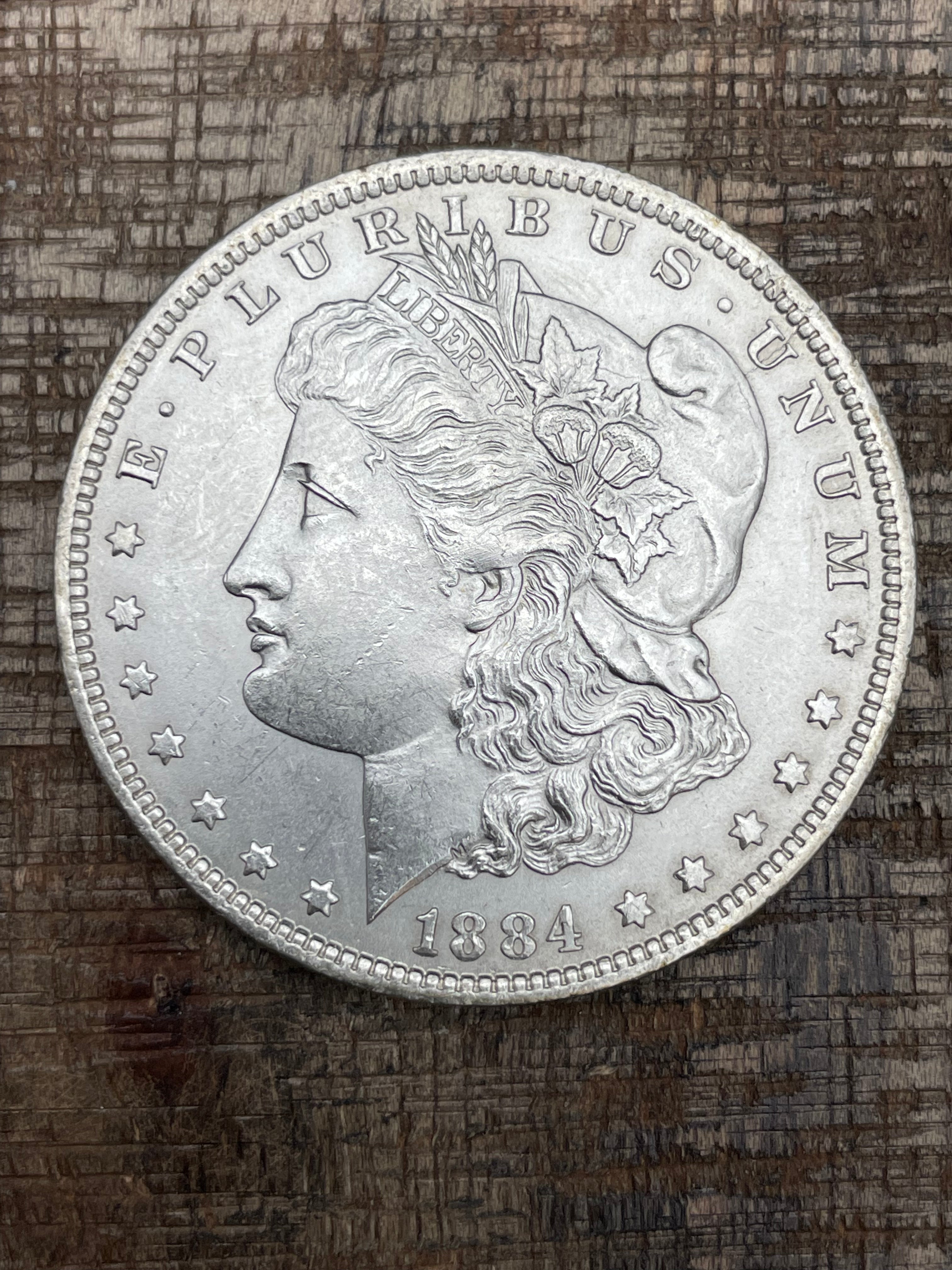 1884-O $1 US Morgan Silver Dollar