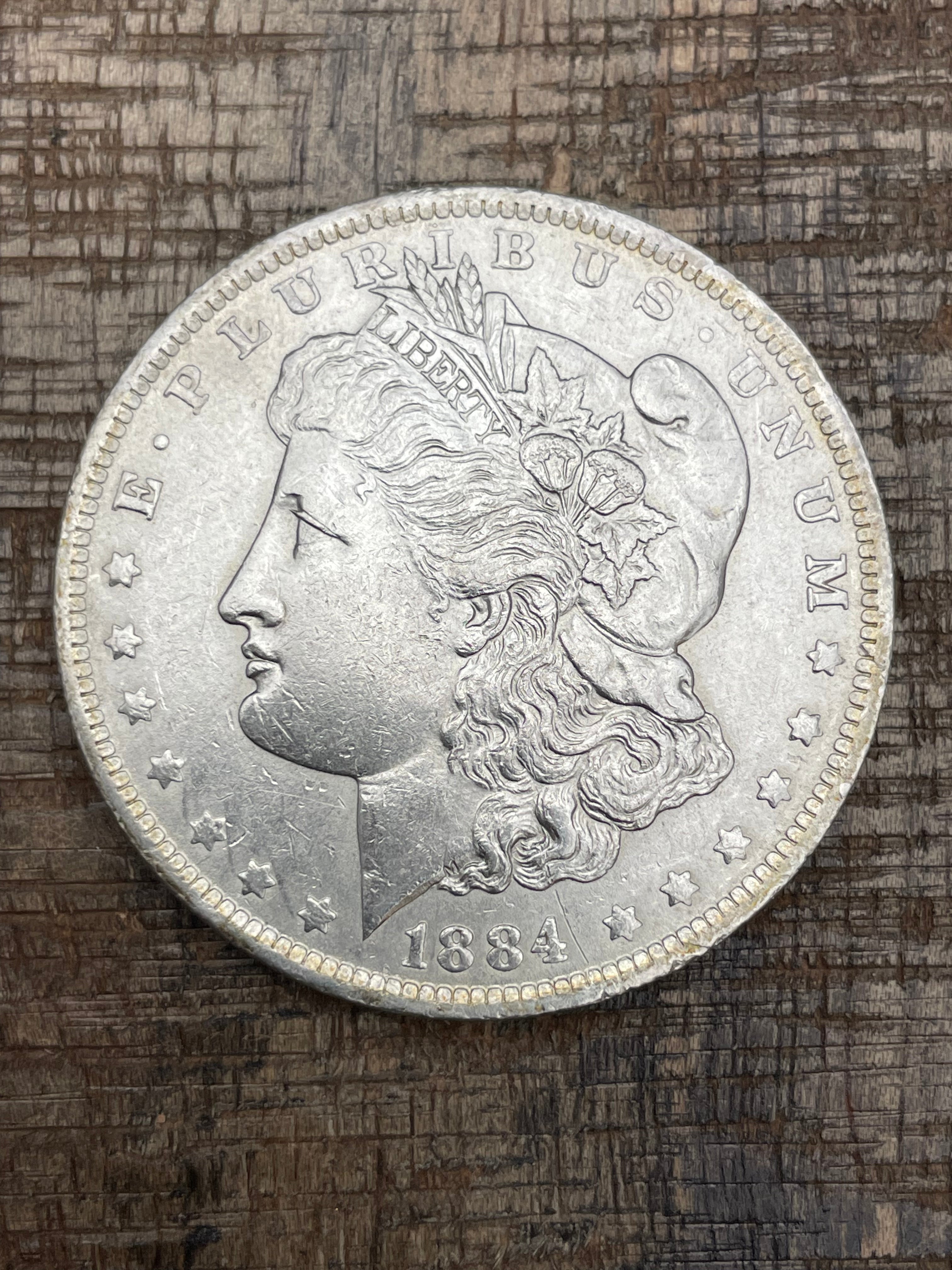 1884-O $1 US Morgan Silver Dollar