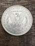 1884-O $1 US Morgan Silver Dollar