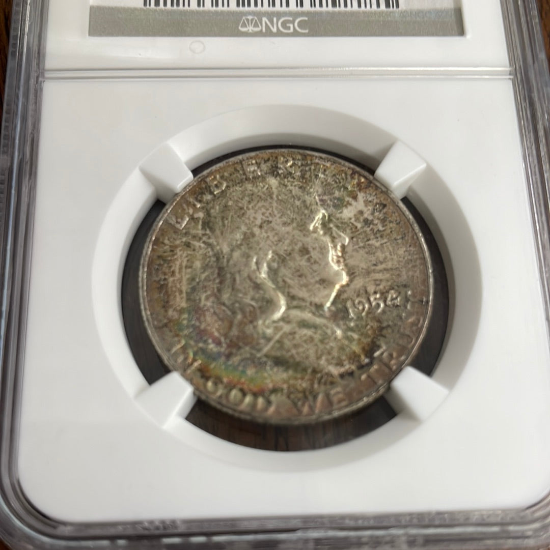 1954 50c Franklin Half Dollar NGC MS66 Rainbow Toned