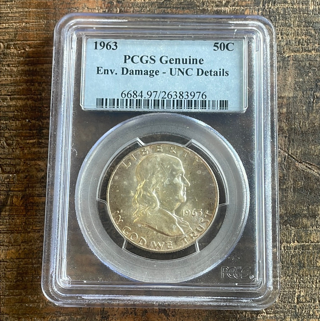 1963 50c Franklin Half Dollar PCGS Genuine Env. Damage-UNC Details