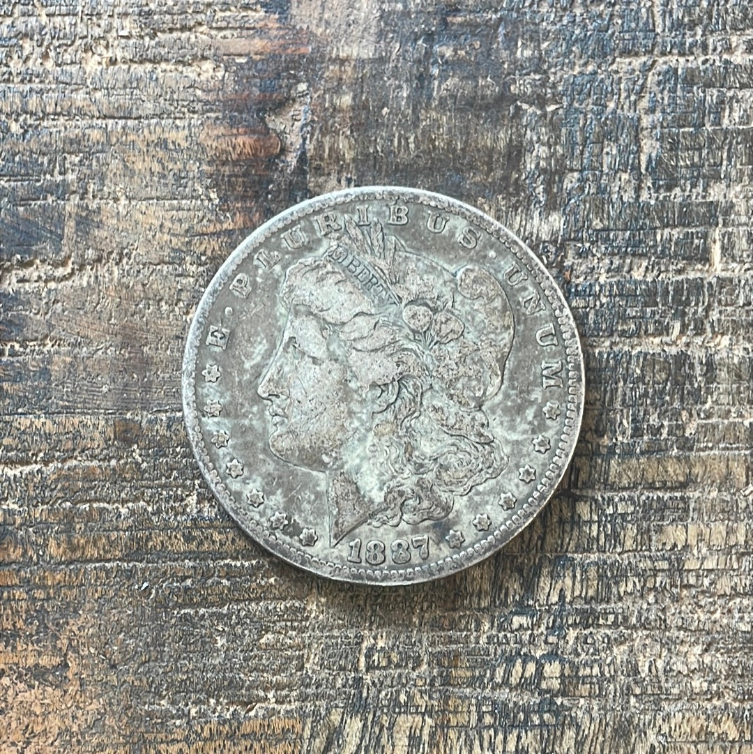 1887-O $1 US Morgan Silver Dollar